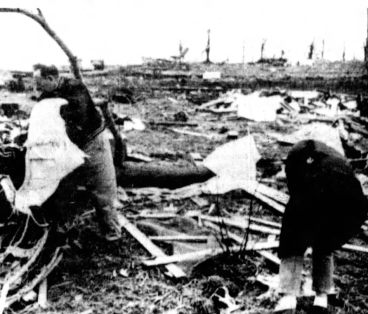 Survivors search the debris of homes at Manitou Beach.