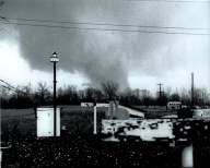 One of two photos of the Cambria tornado, taken by Donald Cox. The photo is facing south from the Rossville area. A large horizontal vortex can be seen developing on the left side of the funnel.
