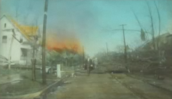 A colorized image of the fire in Murphysboro spreading to a lightly damaged portion of town.