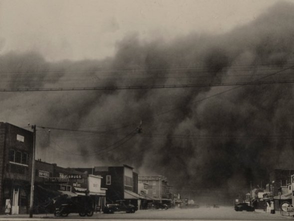 A towering dust storm looms over Ulysses, KS on Black Sunday, April 14, 1935.