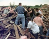 Searchers work to rescue Renee Faulkinberry from the rubble of her home in Country Place Estates.