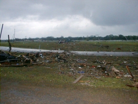 A running track at Tinker AFB was damaged and covered in debris.